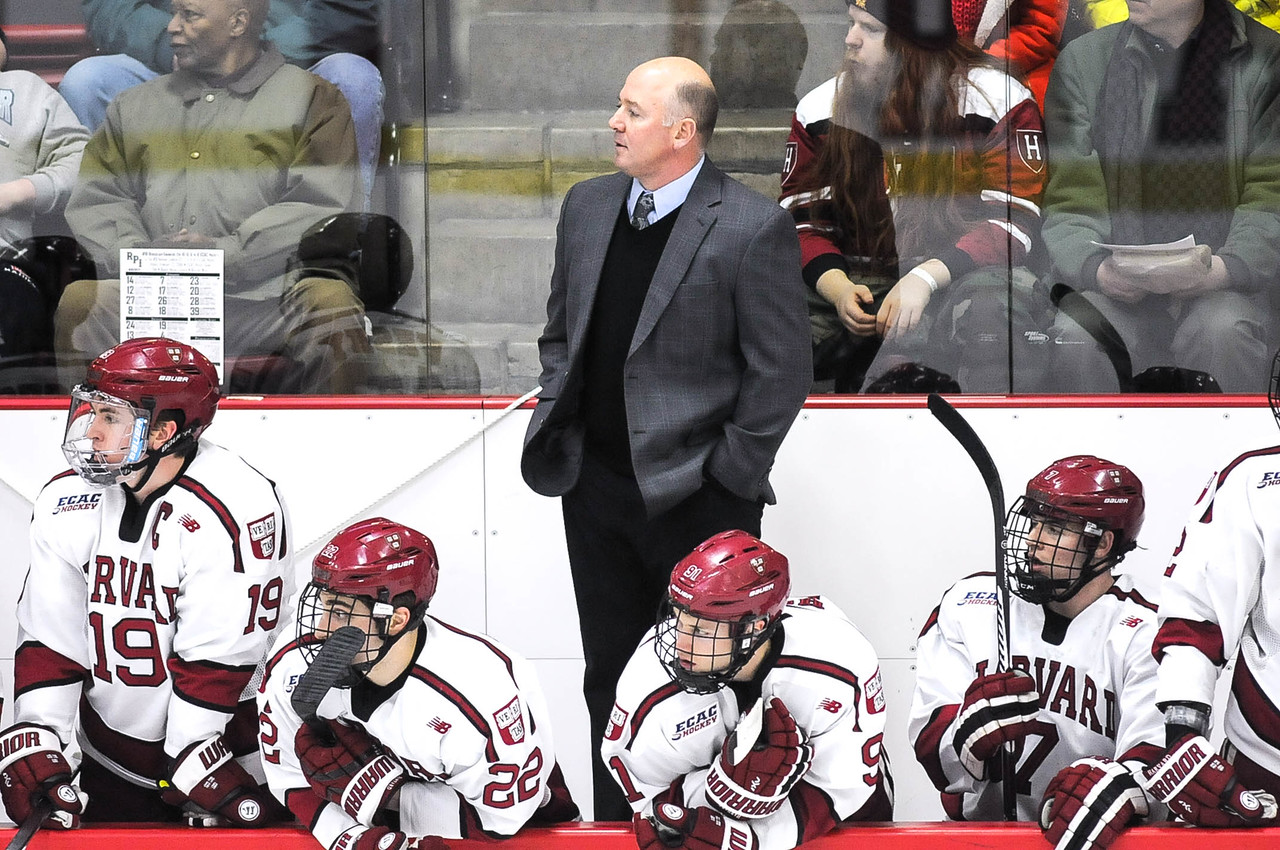 Harvard coach Ted Donato, seen behind the bench during a game against RPI, has overseen the ups and downs of the program during his 12-year tenure with Harvard.