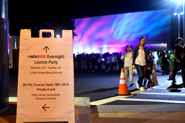 Visitors attending the Museum of Fine Arts' #mfaNOW launch party walk around the entrance to the museum on Saturday night. The launch party was hosted first come first serve with no advance tickets, according to the museum website.