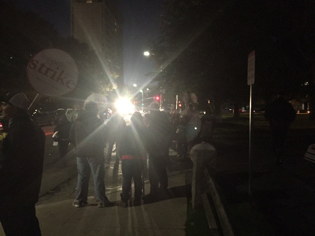 Harvard dining services workers begin their strike early Wednesday morning outside Annenberg dining hall. 