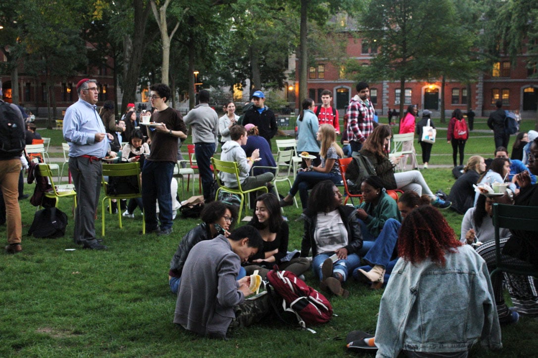 Students show support for striking HUDS employees by eating dinner in Harvard Yard Thursday evening. The dine-in was organized by Harvard Student Labor Action Movement in support of the HUDS workers’ ongoing strike.