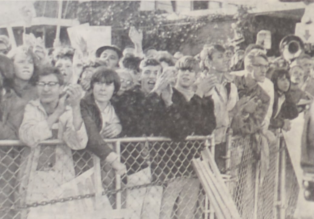 From The Harvard Crimson's October 7, 1964 issue: "An emotion-charged crowd awaited President Johnson at the Burlington, Vermont airport. The youthful group changed 'Hey, hey, what o you say; All the way with LBJ,' as if at a football rally, while the President shook hands along the fence". 