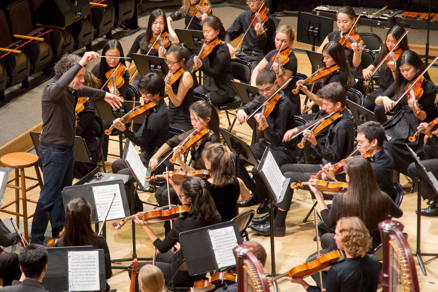 Los Angeles Philharmonic Music & Artistic Director Gustavo Dudamel conducts a performance by the Longy School of Music’s Sistema Side by Side Orchestra in Sanders Theatre last Monday.