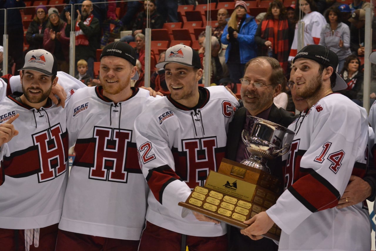 Members of the Crimson pose with the trophy.