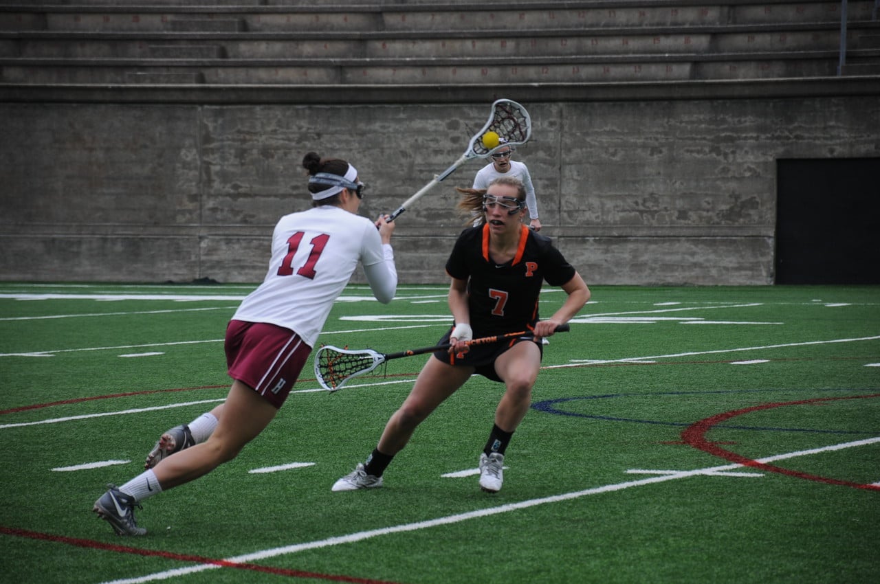 Senior defender Robyn White drives against a Princeton defender last season in a losing effort.  The Crimson came up with a simlar result Wednesday night at Harvard Stadium against Massachusetts, which was the team’s second loss in a row after going on a three-game winning streak.
