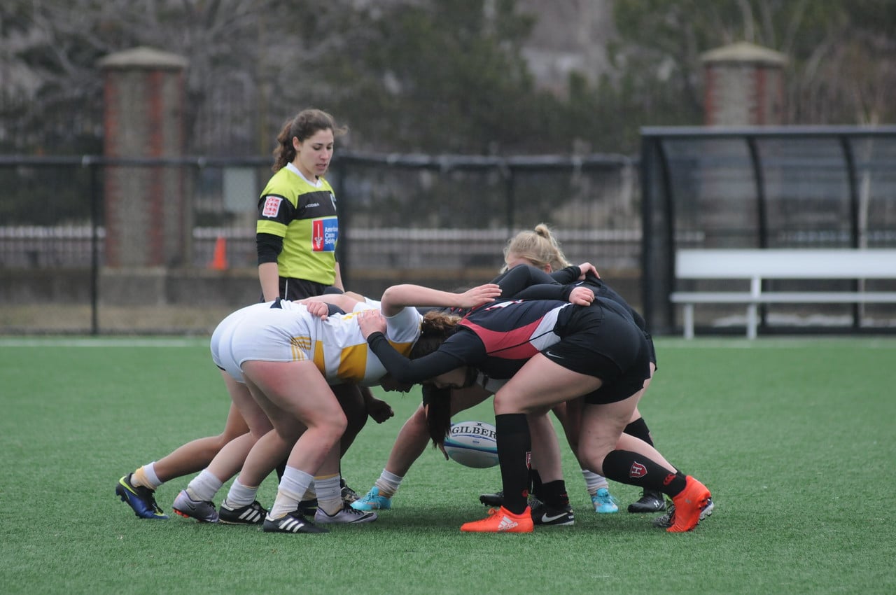 The team engages in a scrum in last year's sevens match against AIC.