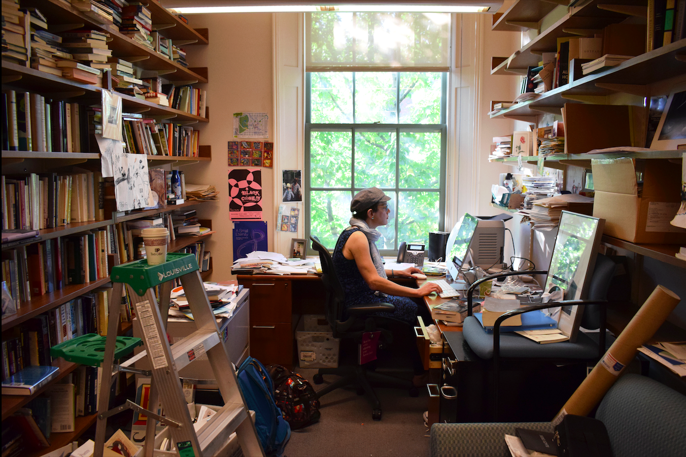 Professor Steph Burt in her book-filled office.