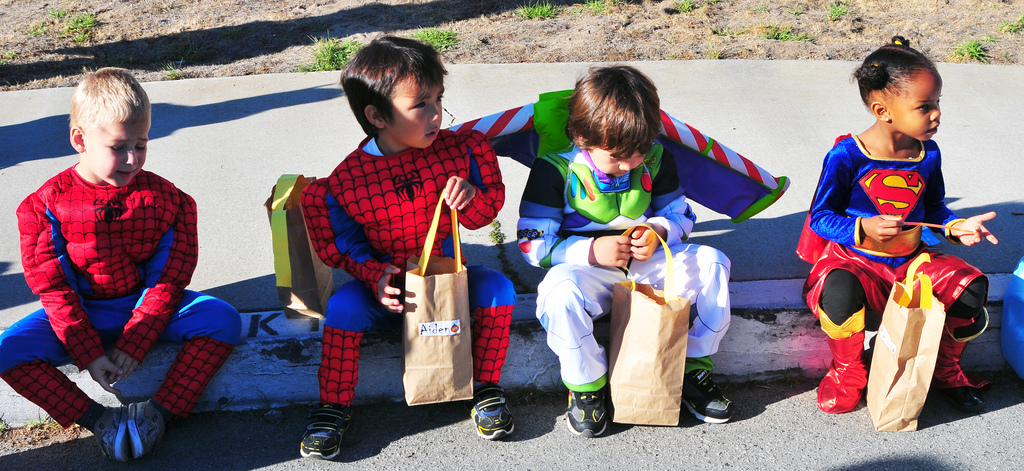 These children may look happy, but some Scorpio is exploiting them for their candy.