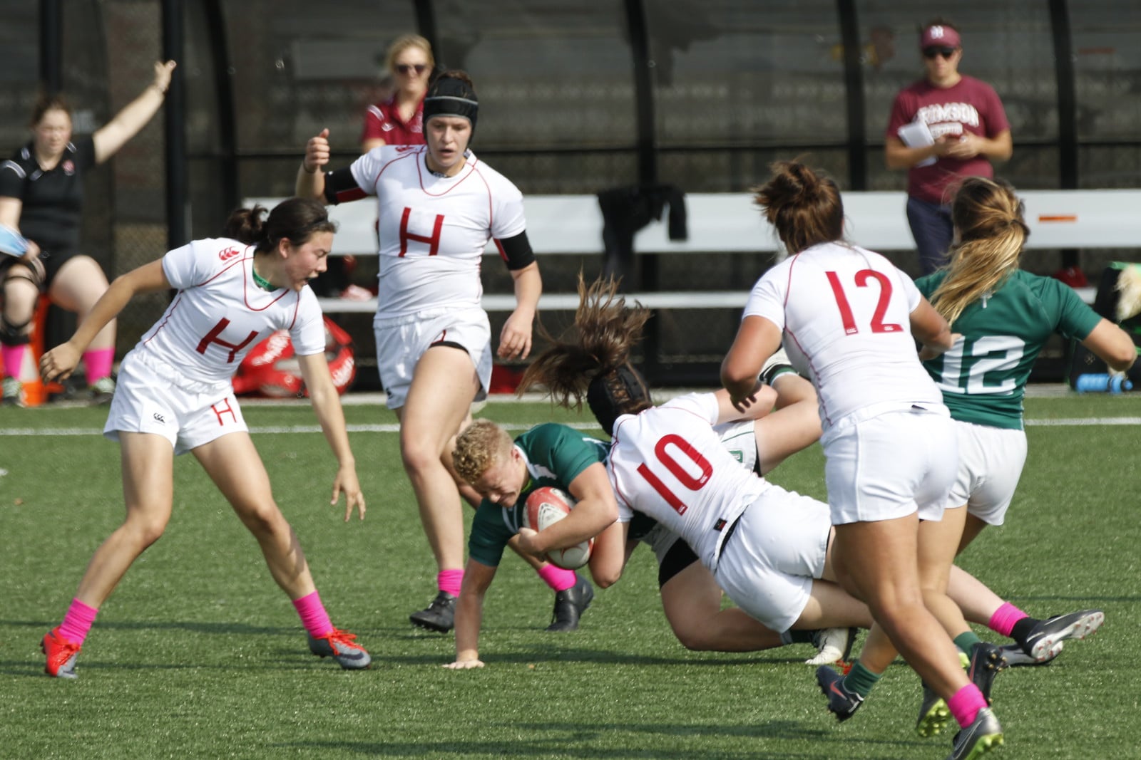 Harvard defenders swarm a Dartmouth ball-carrier in previous action. However, the Big Green stayed on its feet for the most part during its 22-8 Ivy Championship win.