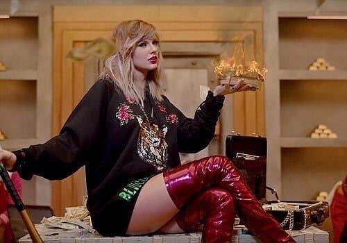 Taylor Swift celebrates her wealth in a still from the music video of "Look What You Made Me Do."