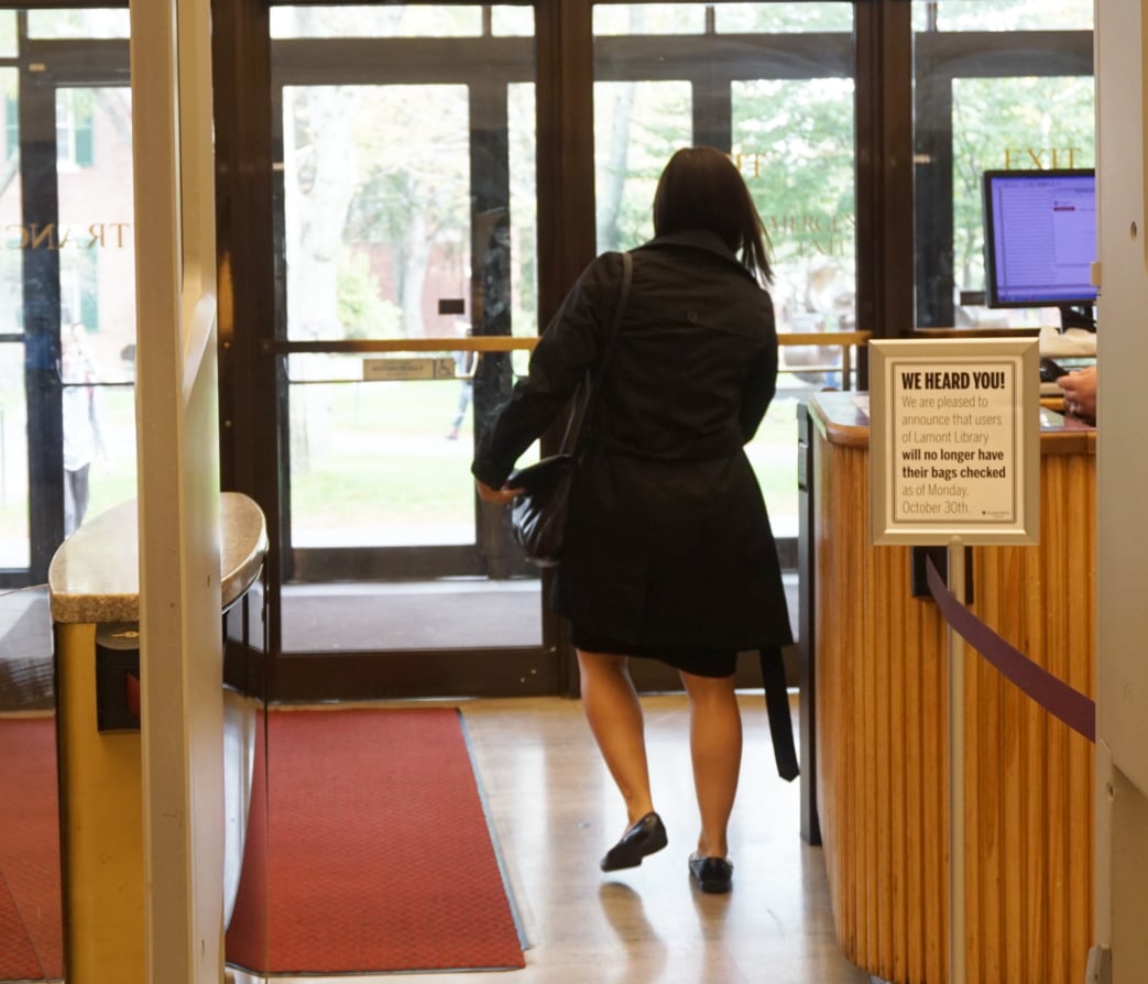 A Harvard affiliate leaves Lamont Library with her bag unchecked.