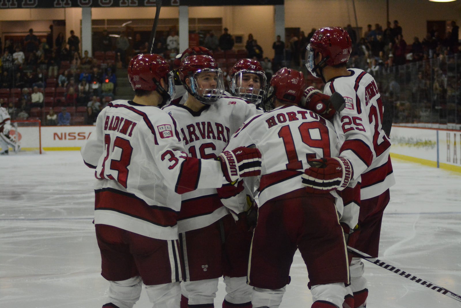The team gathers after scoring its first goal on Saturday night. Unfortunately for Harvard, the second-period rally was not enough to notch the game.