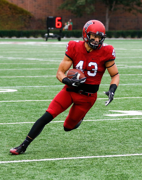 Senior running back Ryan Antonellis sizes up the defender as he turns the corner. Antonellis is the Crimson's leading receiver out of the backfield, with 22 catches so far this season.