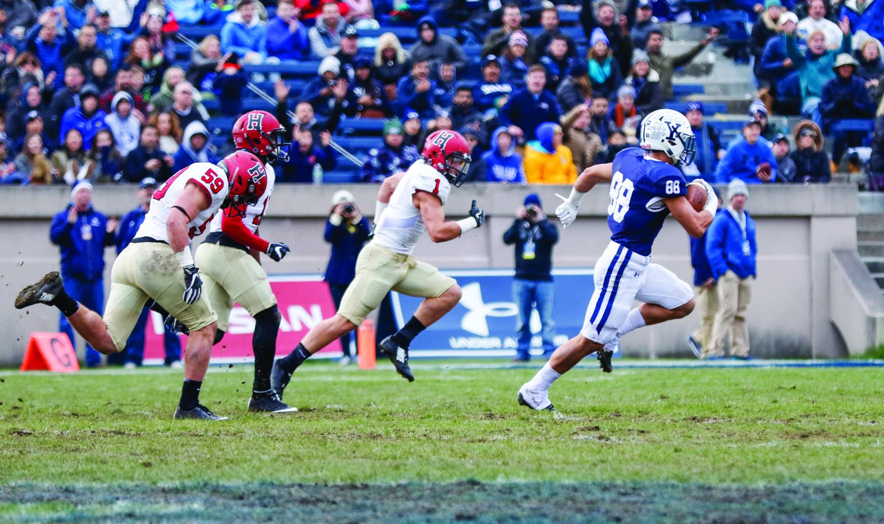 Senior safety Tanner Lee (center) pursues the ball during Harvard-Yale 2017. Lee was named Most Valuable Player and earned the Henry H. Lamar Award for dedication to the football program last weekend.