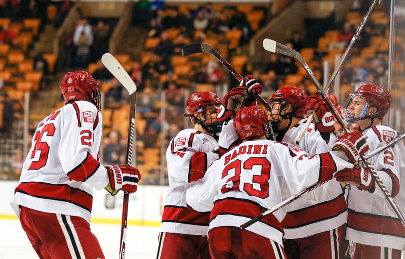 The team celebrates Jack Badini's third-period tying goal. Badini, a freshman, notched his first ever Beanpot point on the tally.