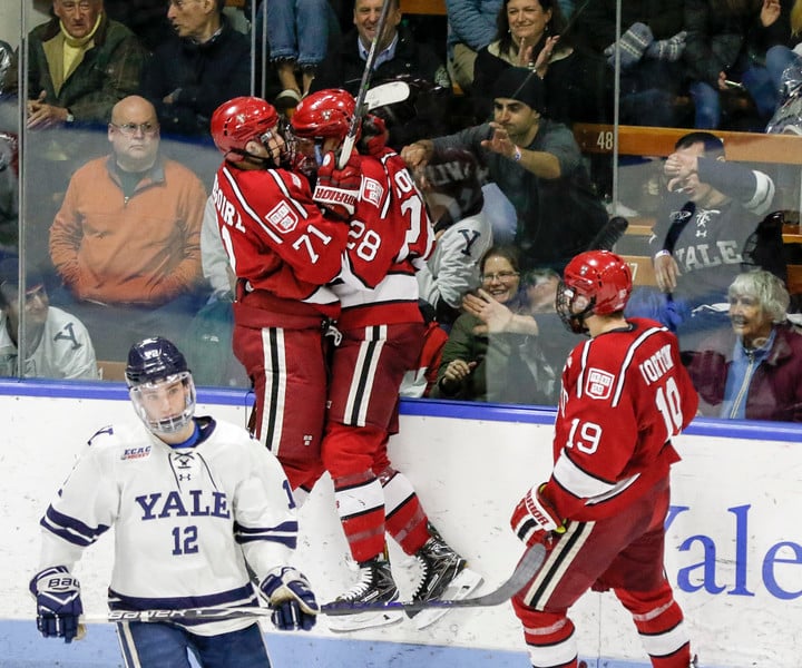 Henry Bowlby and Frédéric Grégoire celebrate after Bowlby broke the ice against Yale for the Crimson. Bowlby's goal was the lone Harvard score in the loss.