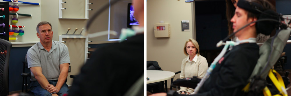 Marty and Sherri watch their son during a physical therapy session.