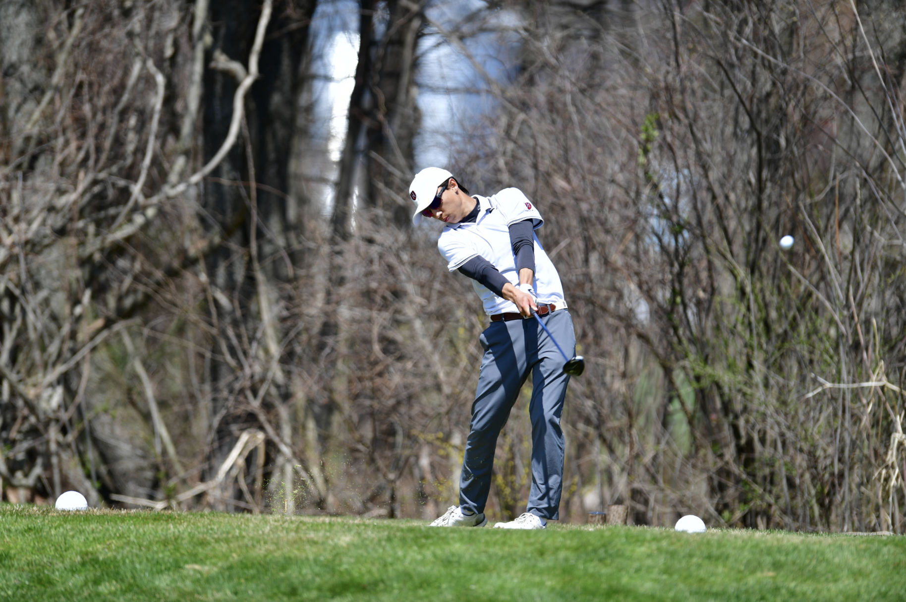 Freshman Grant Fairbairn drives the ball down the fairway. 