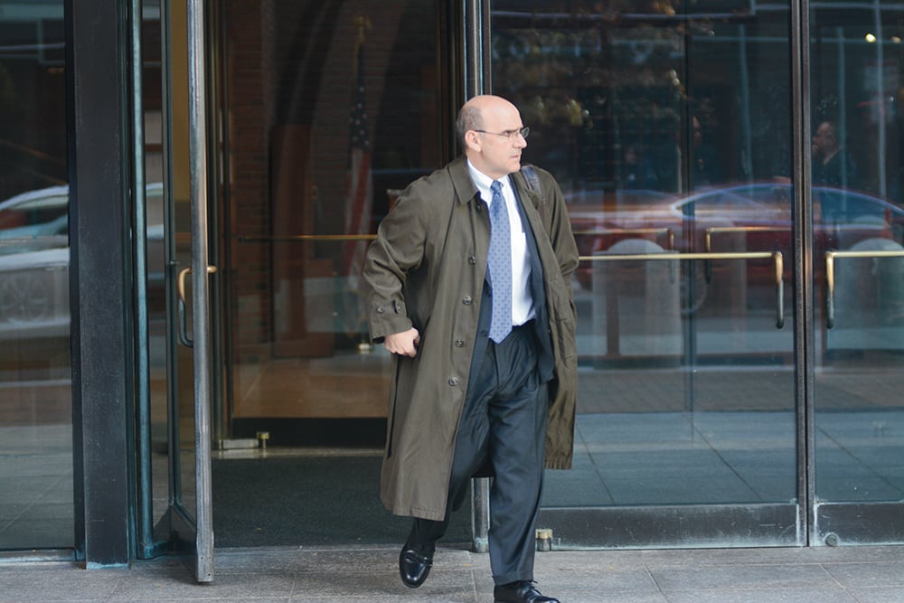 The University's General Counsel Robert W. Iuliano '83 exits the courthouse on the third day of the Harvard admissions trial.