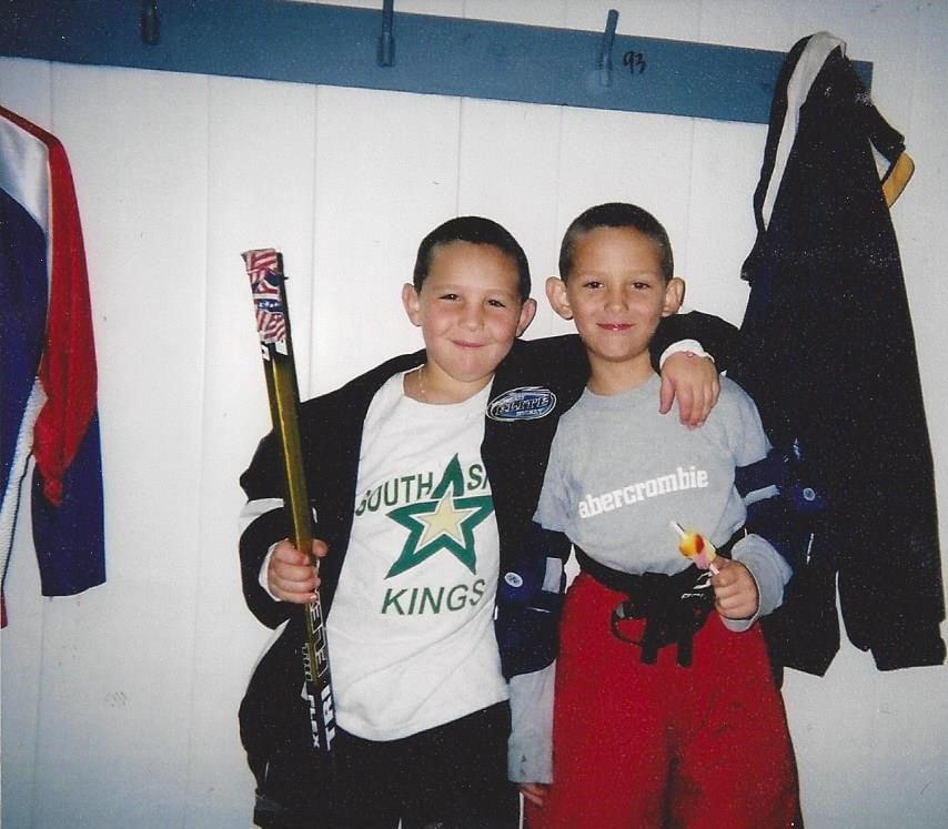 John Marino (right) owes his start in ice hockey to his brother, Paul (left). Since hitting the ice with John at 18 months, Paul has been a steady presence in John's life in and out of the rink.