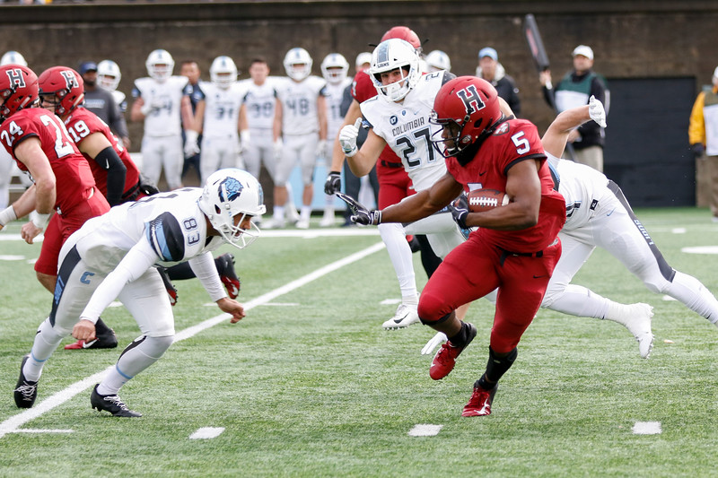 Sophomore running back B.J. Watson attempts to stiff-arm Columbia's kicker during a kick return in the game last weekend.