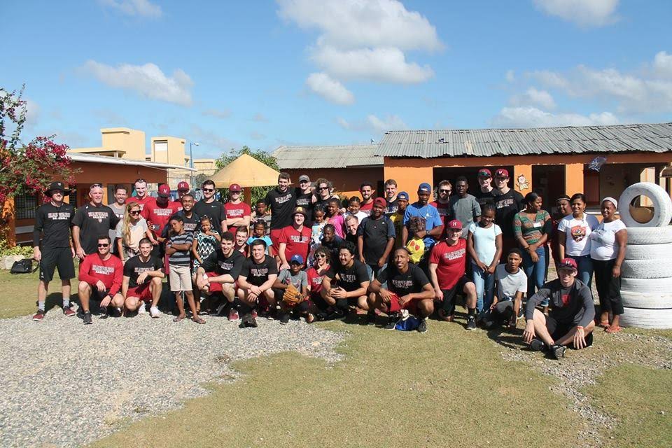 As part of community service efforts, the Harvard baseball team visited Casa de Amor orphanage.