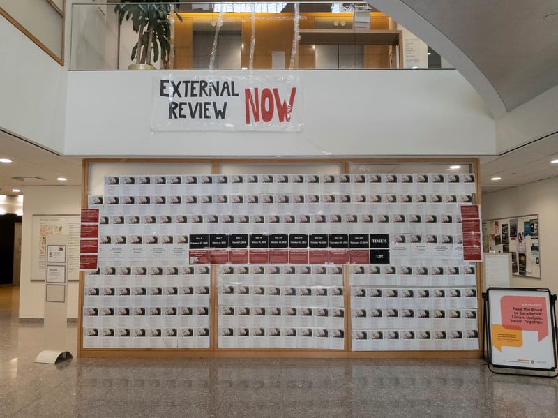 The Center for Government and International Studies lobby was covered with printed copies of the original Chronicle of Higher Education article about Professor Emeritus Jorge I. Dominguez. The posters accompanied a protest calling for an independent review of the allegations against him.
