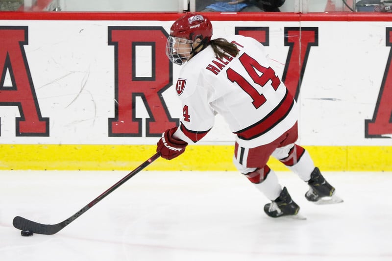 Senior co-captain Kate Hallett controls the puck in what ended up as her final game for the Crimson.