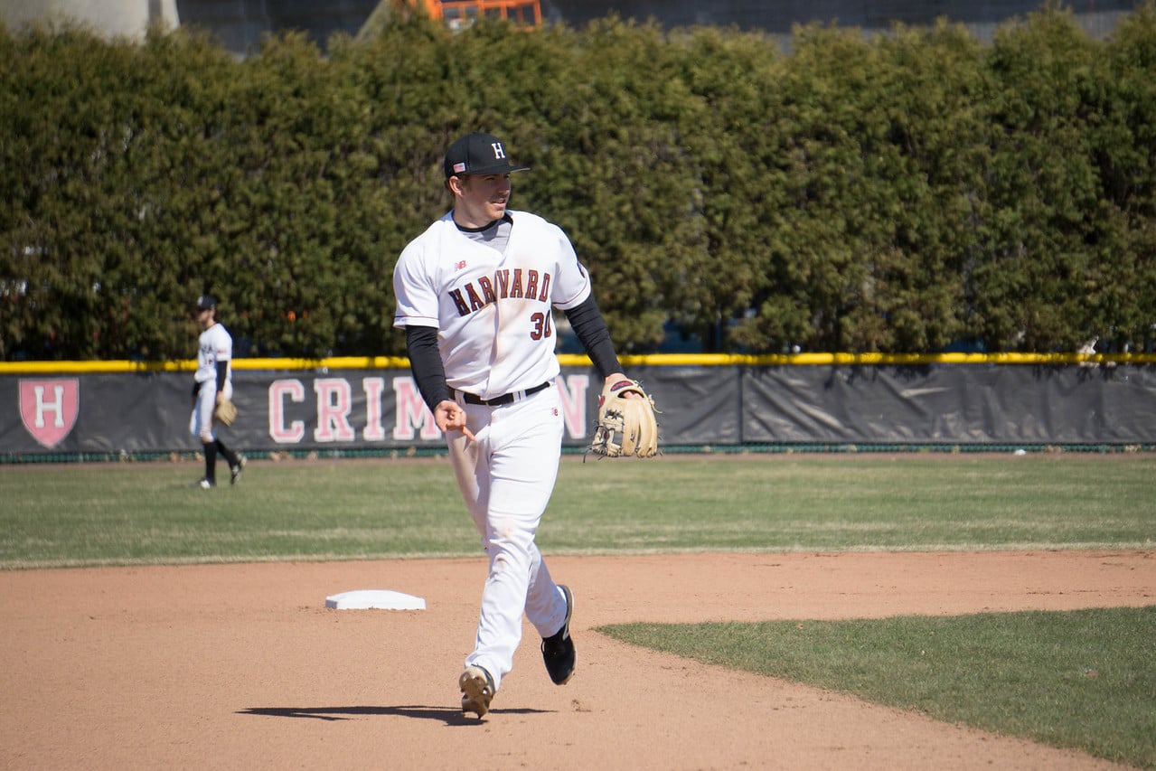 Junior Hunter Bigge jogs back to the infield during a Harvard game against Penn last year. The Crimson beat the Quakers in this year's series against Penn, 2-1.