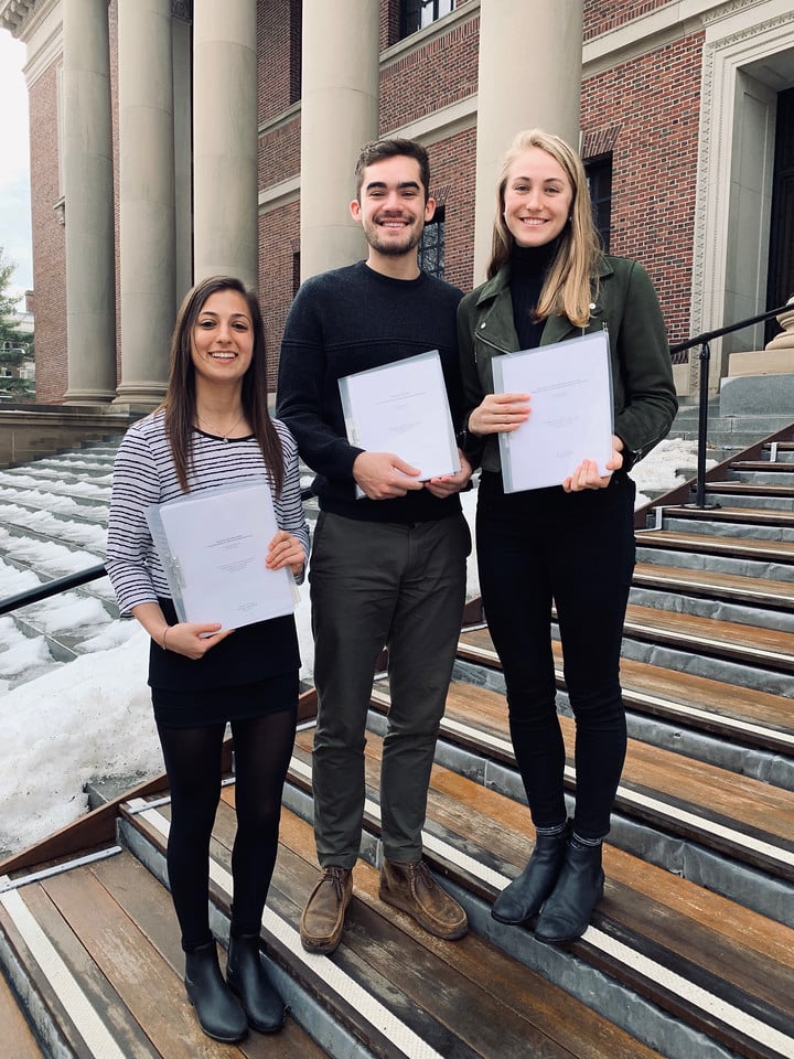 Niki Smith (pictured left), Andrew Bolze (center), and Claire Rushin (right) pose in front of the Widener Steps.