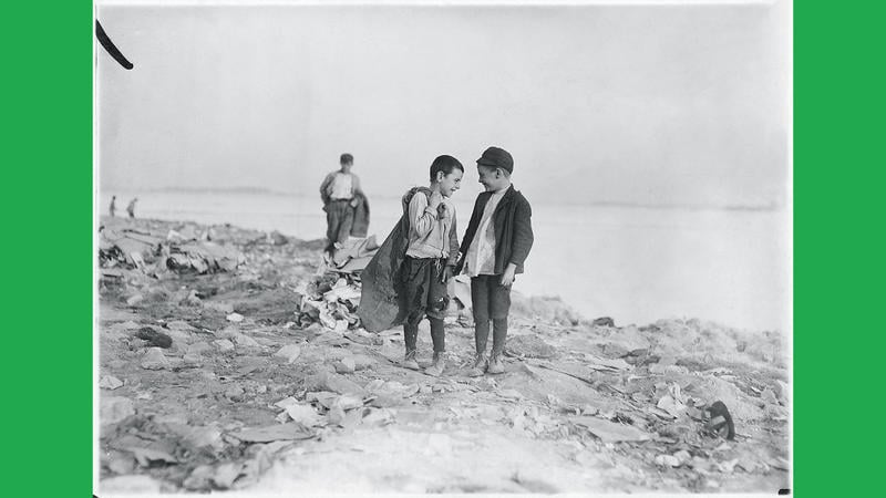 Lewis Hine's 1909 photo, "Boys Picking Garbage from 'The Dumps.'"