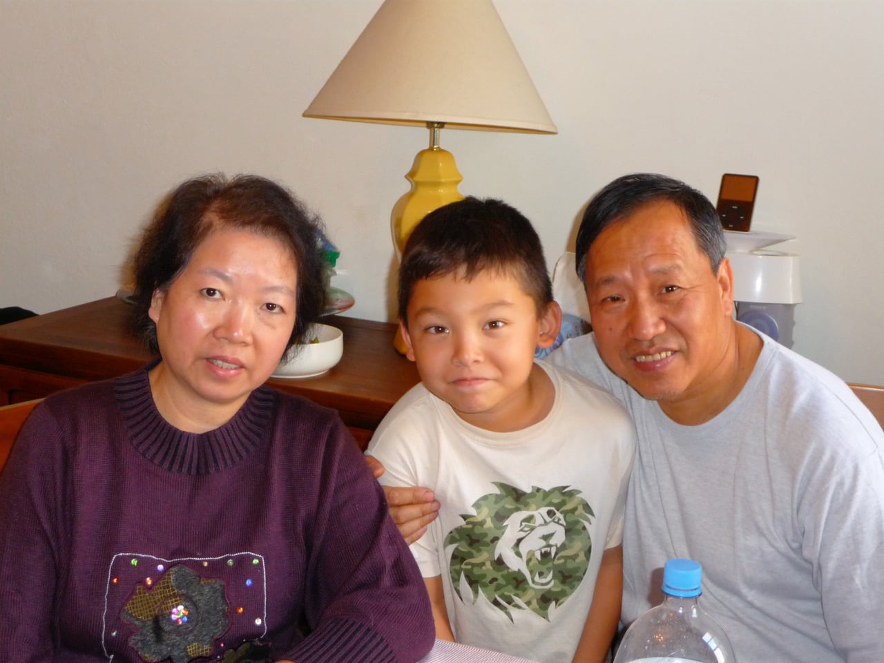 5-year-old Matteo N. Wong '22 sits with his grandparents in his home in Brooklyn.