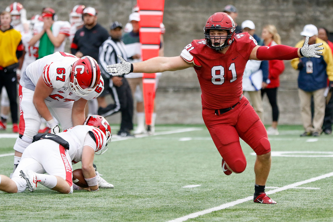 Senior defensive lineman Brogan McPartland celebrates with arms extended following a sack of the Cornell quarterback in last weekend’s matchup.