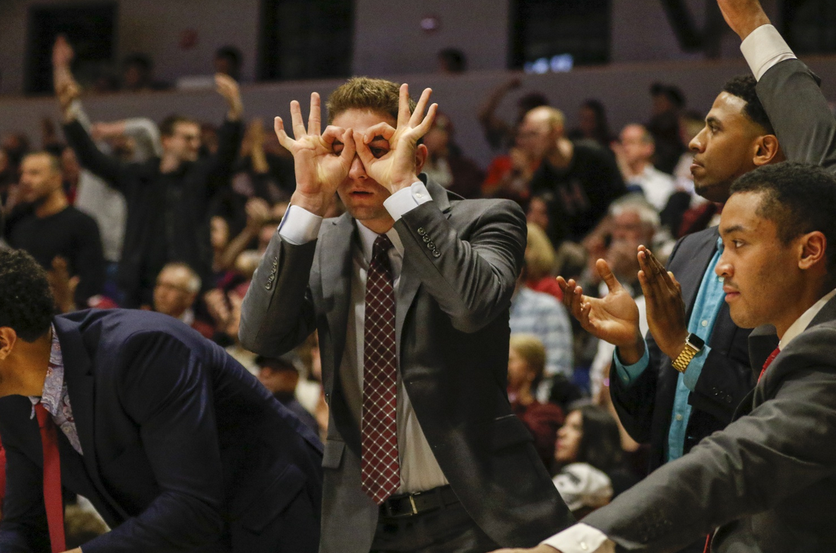 An injured Farley celebrates a three-pointer in a crucial win over Penn last season