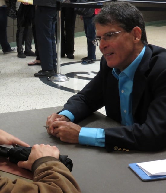 Dr. Eben Alexander is chatting at a conference.