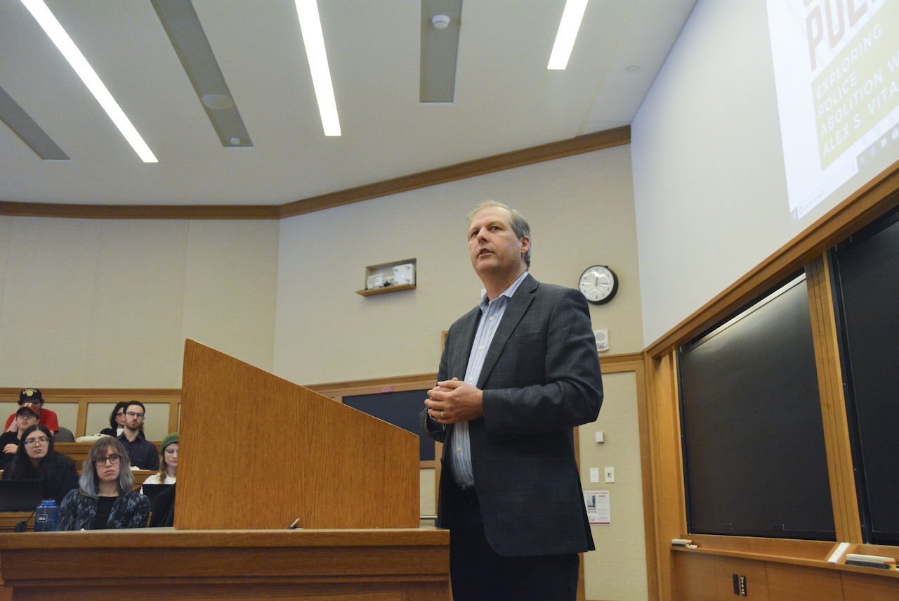 Alex Vitale, the coordinator of the Policing and Social Justice Project at Brooklyn College, addresses issues with policing in the United States  at a Harvard Law School event Thursday.