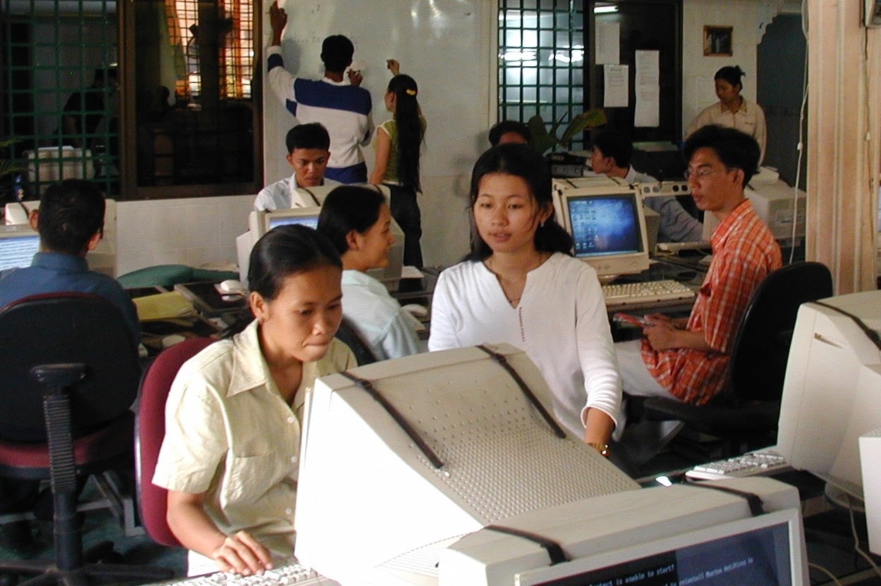 Digital Divide Data employees transcribing The Crimson.