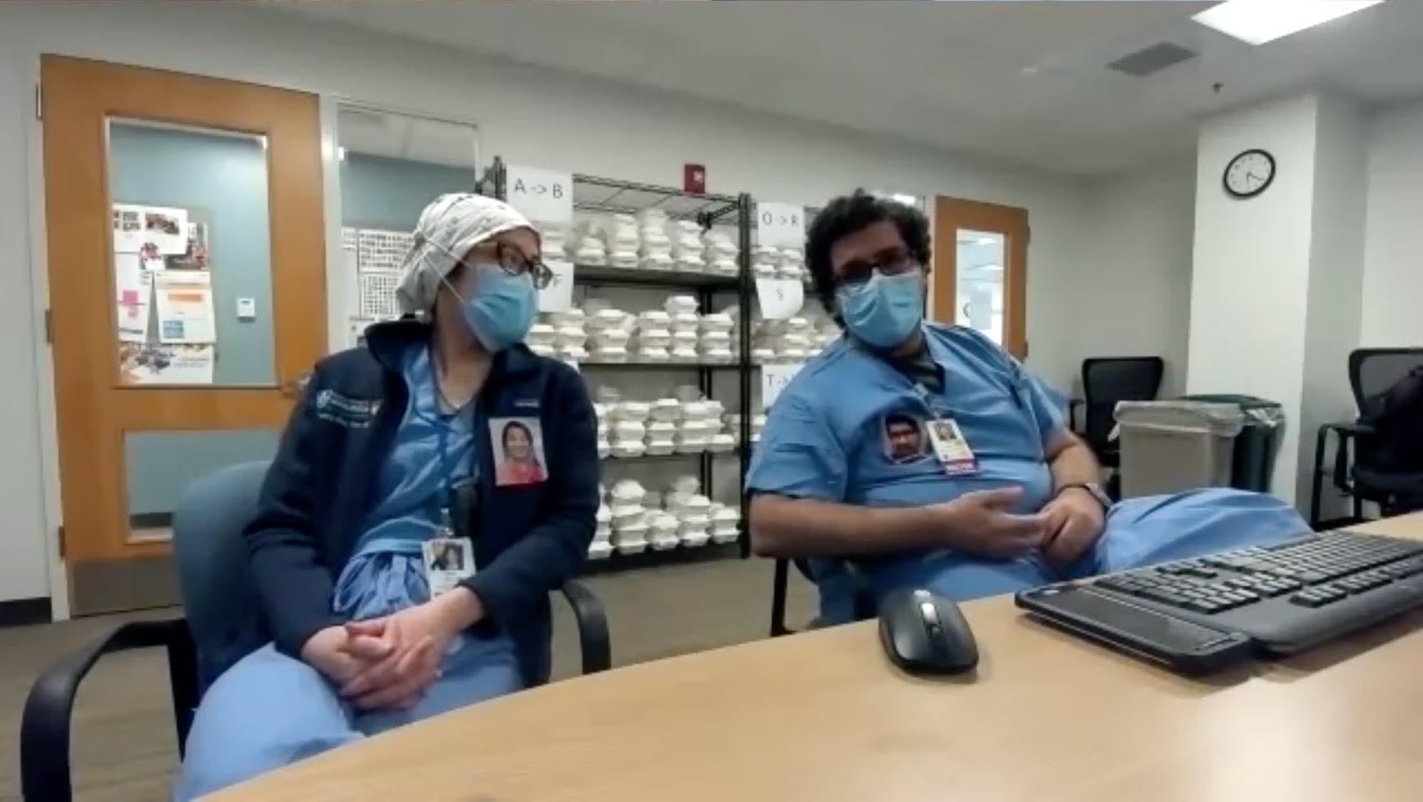 Doctors Sampat and Tran of the MGH Happiness Committee, their headshots affixed to their scrubs as part of the committee's PPE Portrait Project.