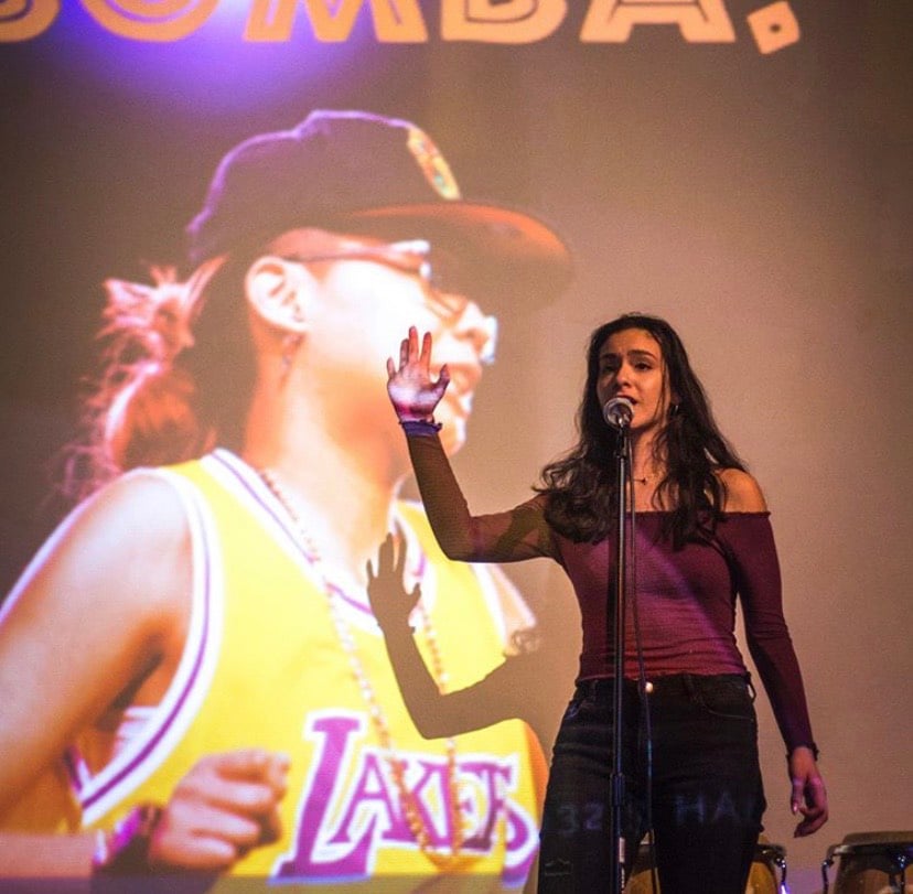 Alegria performs slam poetry.