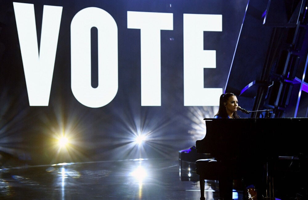 A photo of Demi Lovato performing "Commander in Chief" live