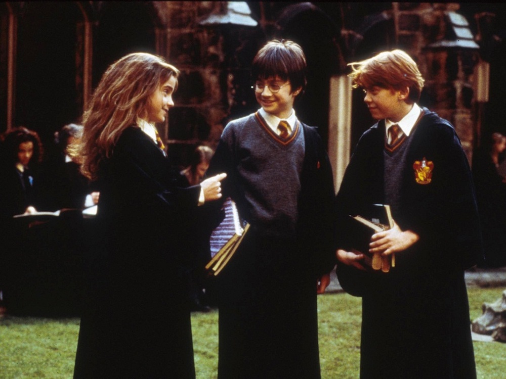 Emma Watson as Hermione, Daniel Radcliffe as Harry, and Rupert Grint as Ron in the "Harry Potter" franchise.