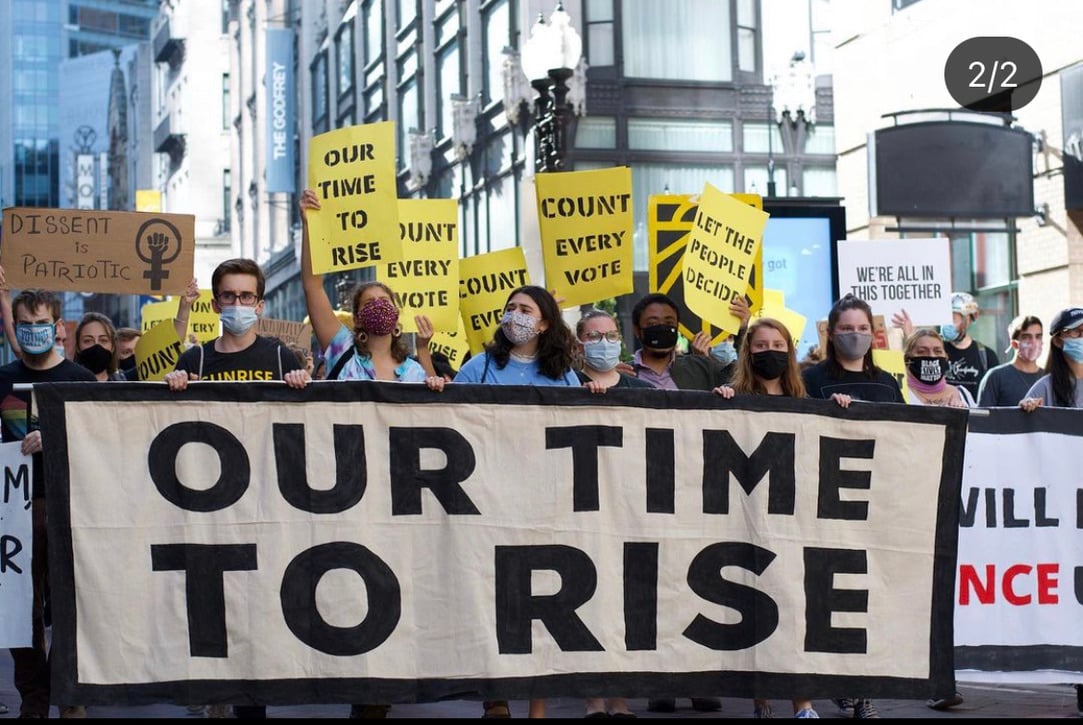 Young people march for climate action at a Sunrise Movement protest. Sunrise is a national organization working to stop climate change and create green jobs.