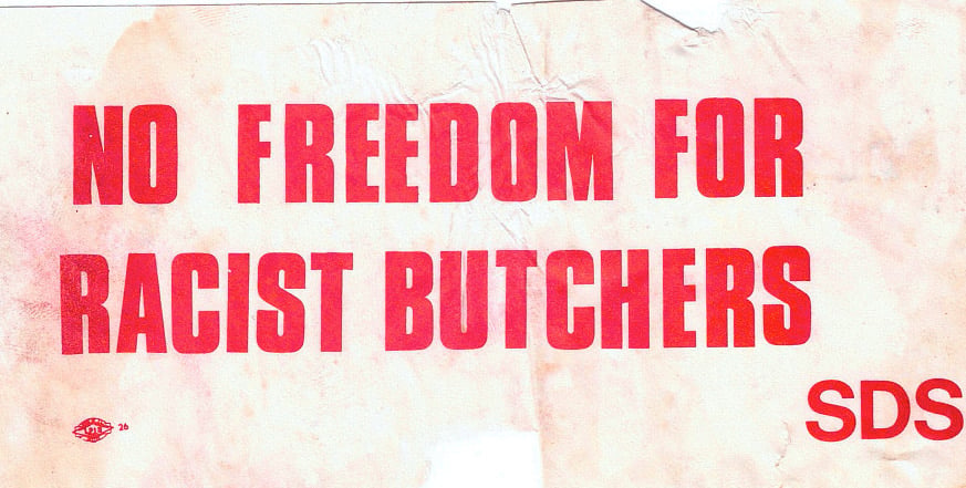 A chorus pounded the walls of Sanders Theatre: “U.S. out of Southeast Asia; butchers out of Harvard!”