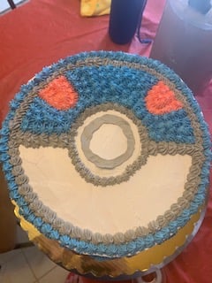 A blue Pokéball Cake, one of many cakes Paula Martinez bakes for friends on the side for additional income.