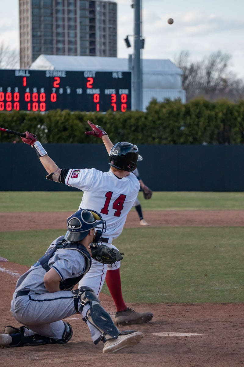 Matt Thomas ’21 launches a drive into left field against rival Yale in an April 2019 meeting.