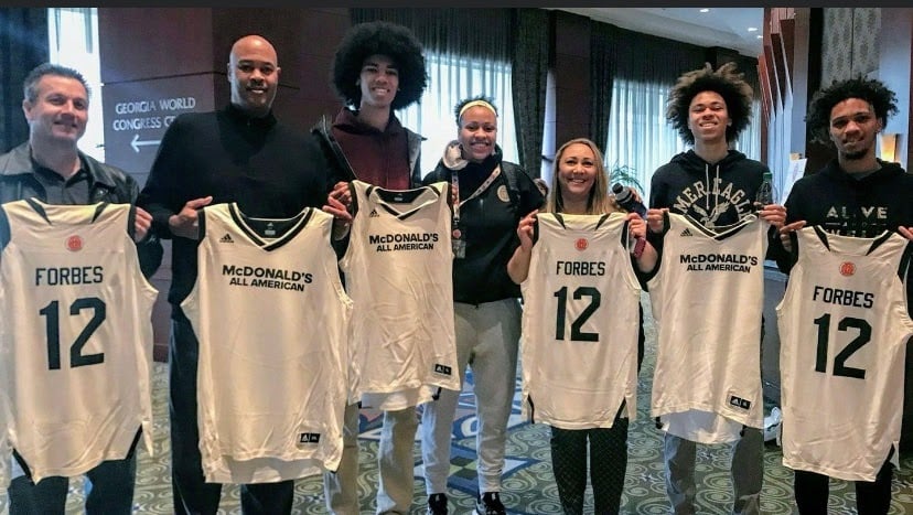 The Forbes family proudly displays McKenzie’s jersey at the McDonald’s All-American Game.