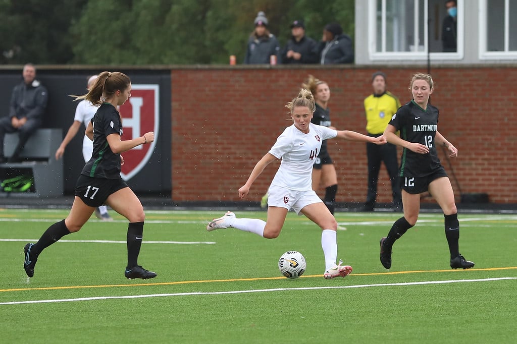 Harvard midfielder Hannah Bebar fires a shot during a game against Dartmouth earlier this year. Ultimately, Harvard compiled a 15-3-1 record on the season, which ended Sunday at the hands of Wake Forest.