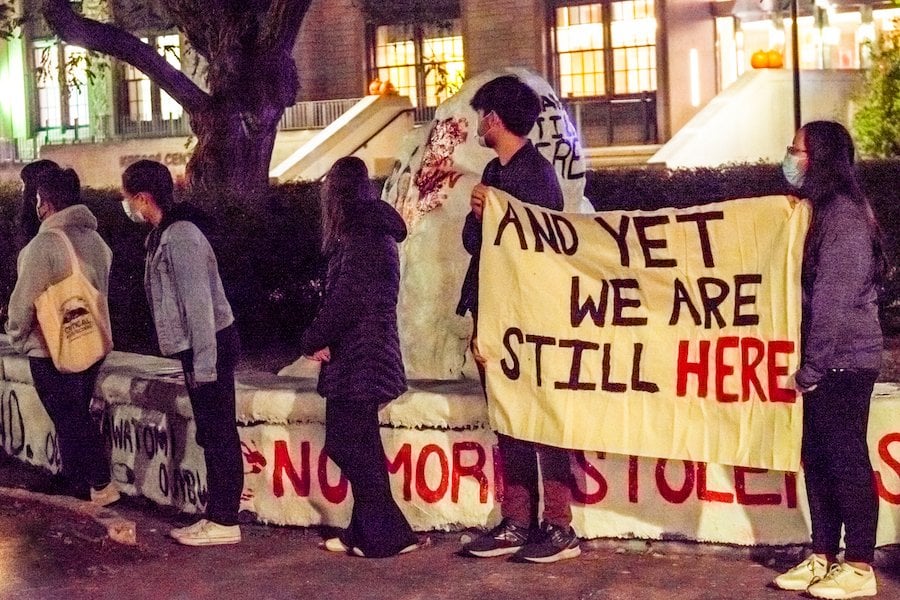 NAISA students led a reflection at The Rock Sunday night in response to the anti-Indigenous vandalism that defaced their painting of The Rock for Native American Heritage Month.