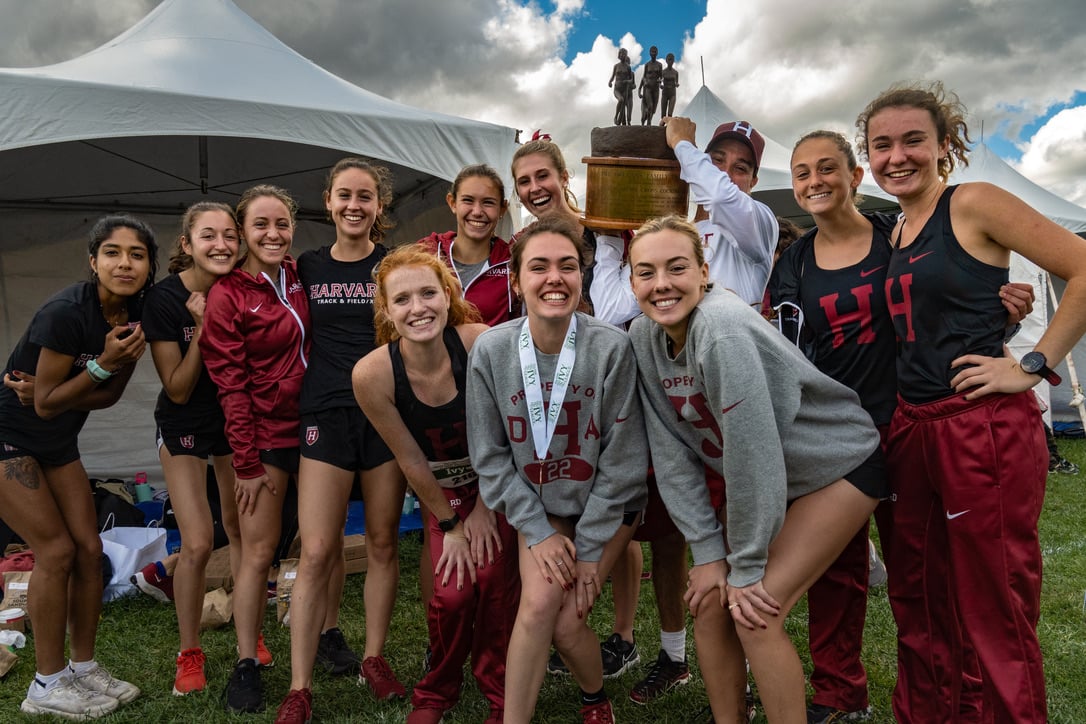 The Harvard women's cross country team celebrates its 2021 Ivy League Championship on October 30th. Crimson women's XC won NCAA Northeast regionals this past weekend, with the men's team finishing second as they both gear up for NCAA nationals this weekend.