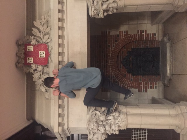 In this undated photo, a student uses the Westmorly fireplace, with its then-exposed sculptures, as a climbing wall.