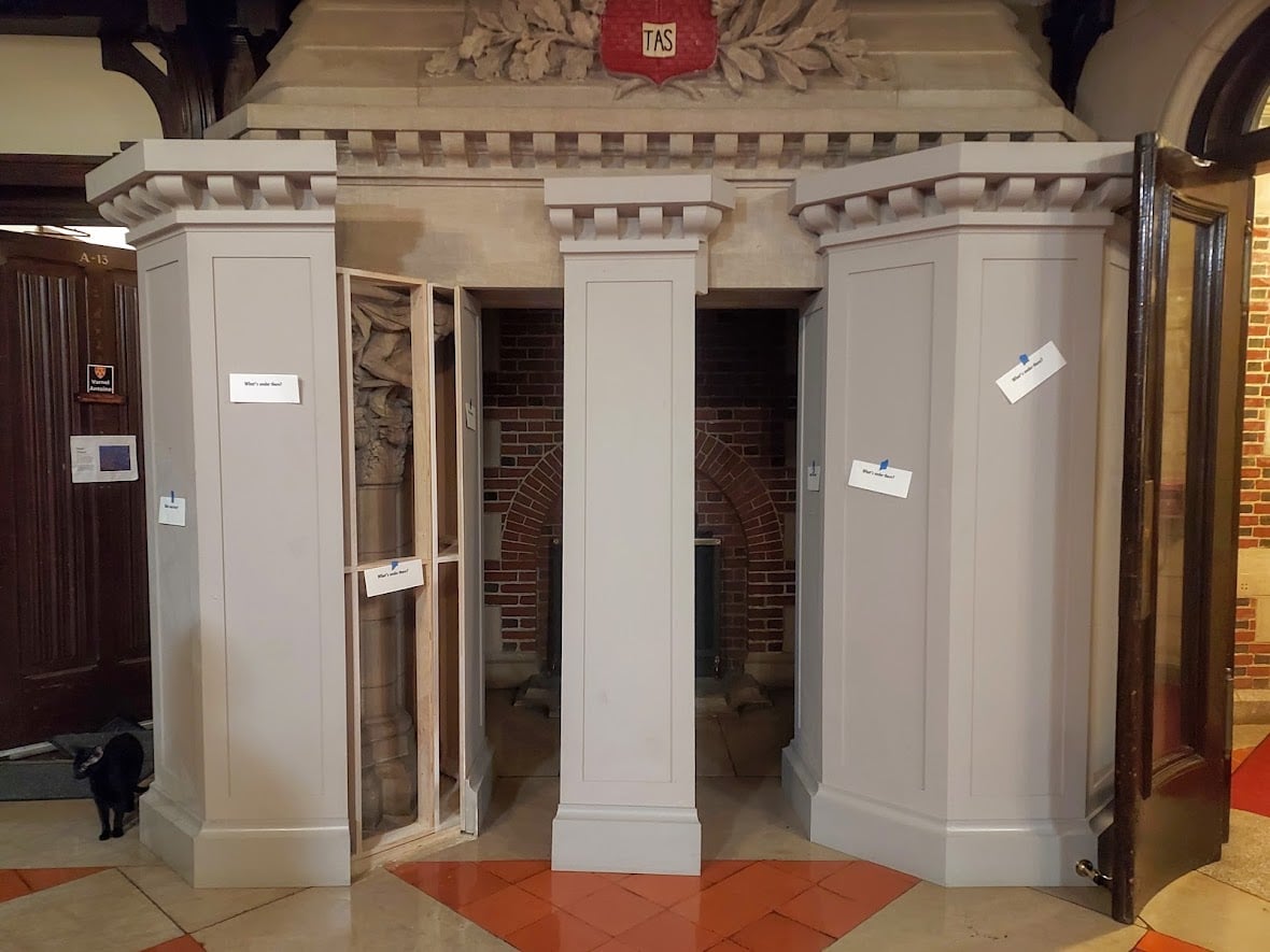 By the evening of April 10, a loose panel on the Adams House fireplace encasing that covered racist sculptures was removed, and signs reading "What's under there?" were pasted over the panels.